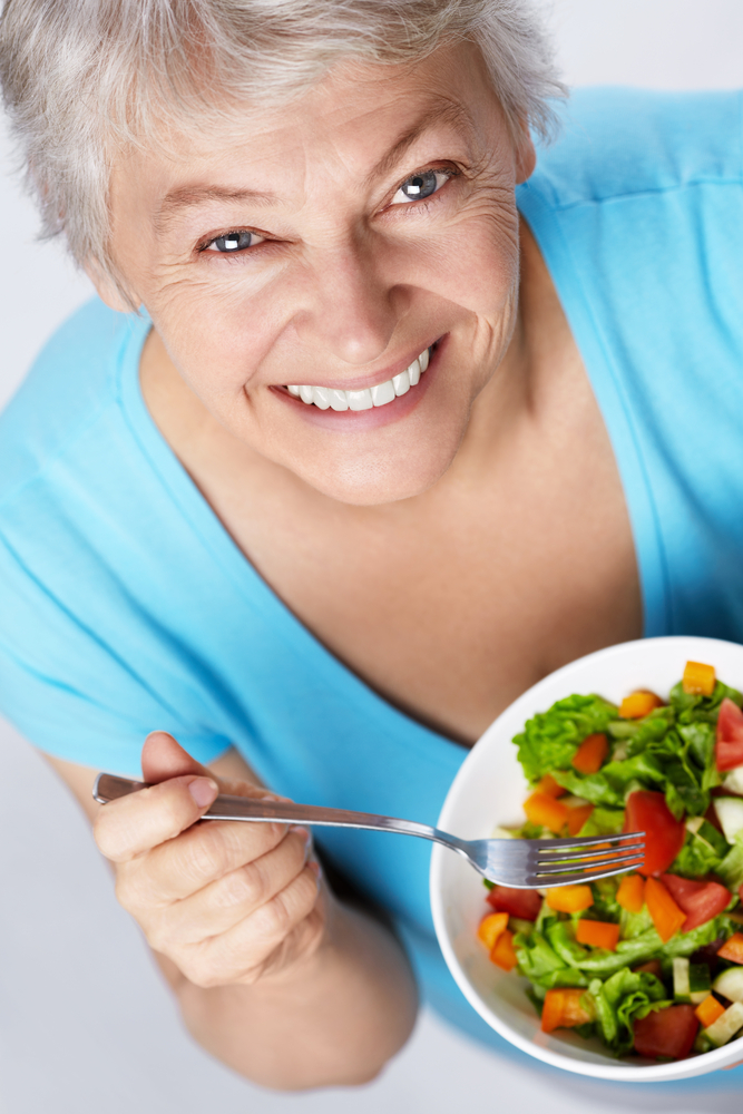 older woman eating salad.jpg